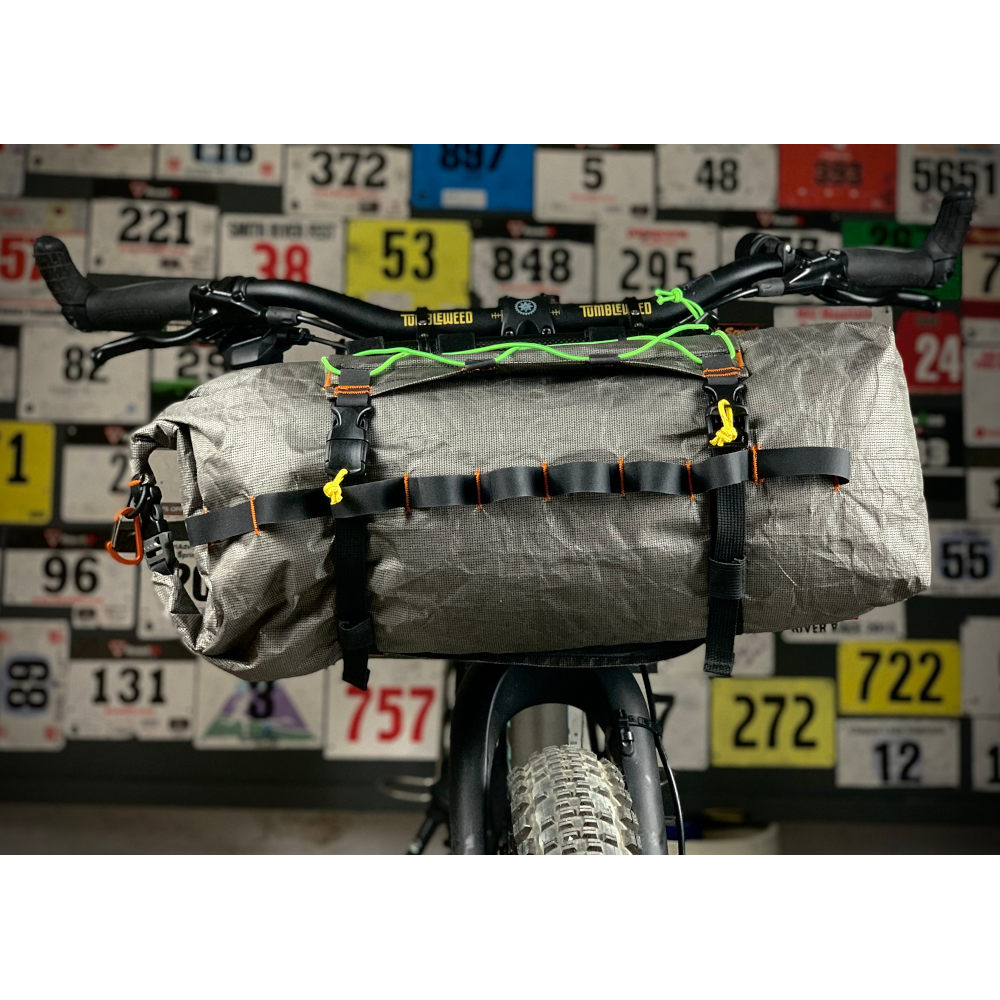 An Ultra 200 X Bike Dry Bag on the front of a bike using the MLD Border Handlebar Harness System